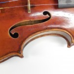 Workshop in advanced violin repair. Retouching of varnish.